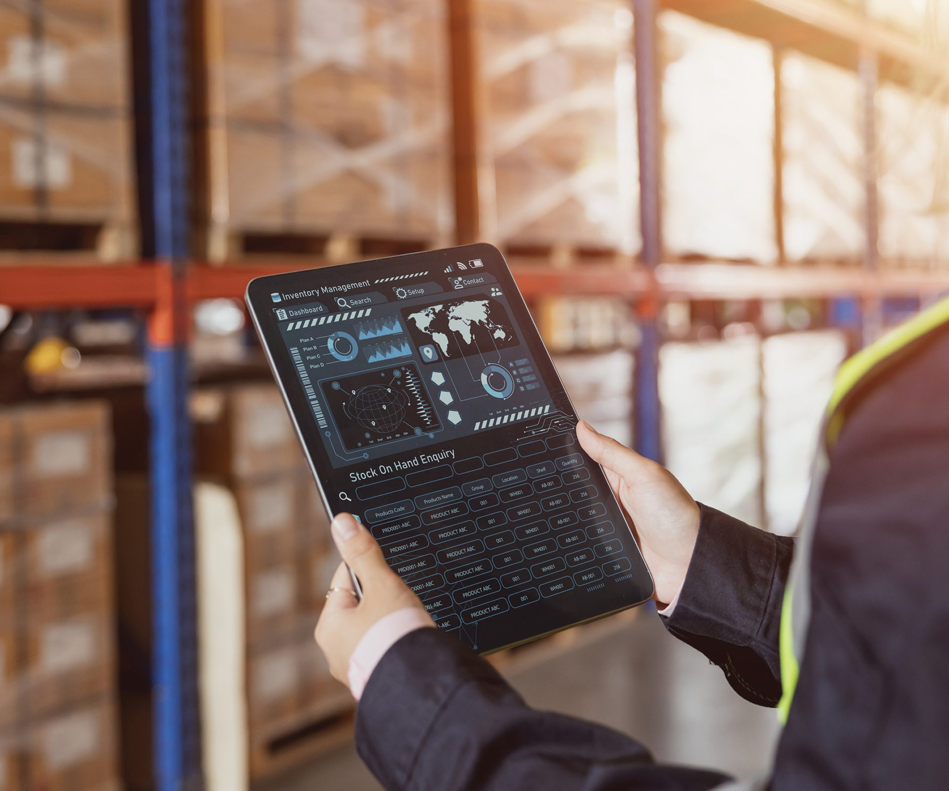 Person using tablet in a warehouse.